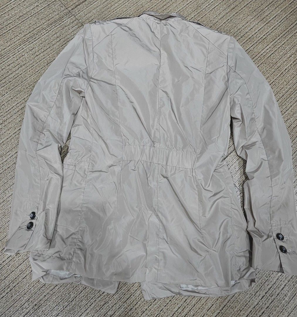 Beige Jacket with Button Details (Category: Coats, Jackets and Outerwear) located in Manila. Submitted by kris.jul (Listing ID 1462870807, Image 2). Description: - Lightweight beige jacket - Chest pockets - Button front closure - Double button detail on cuffs - Elasticated back waist for a fitted look - Ideal for layering .