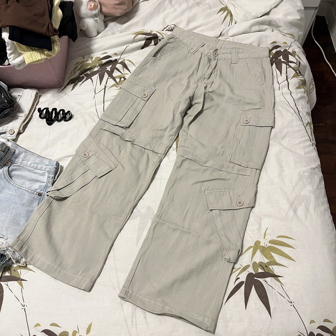 Beige Low Waist Cargo Pants (Category: Other Bottoms) located in Las Pinas. Submitted by thevallerys (Listing ID 1462827280, Image 2). Description: - Beige cargo pants - Multiple pockets - Fits size 25 - Fits petite height girls, had it altered to my height - Button and zip closure - Wide leg fit.