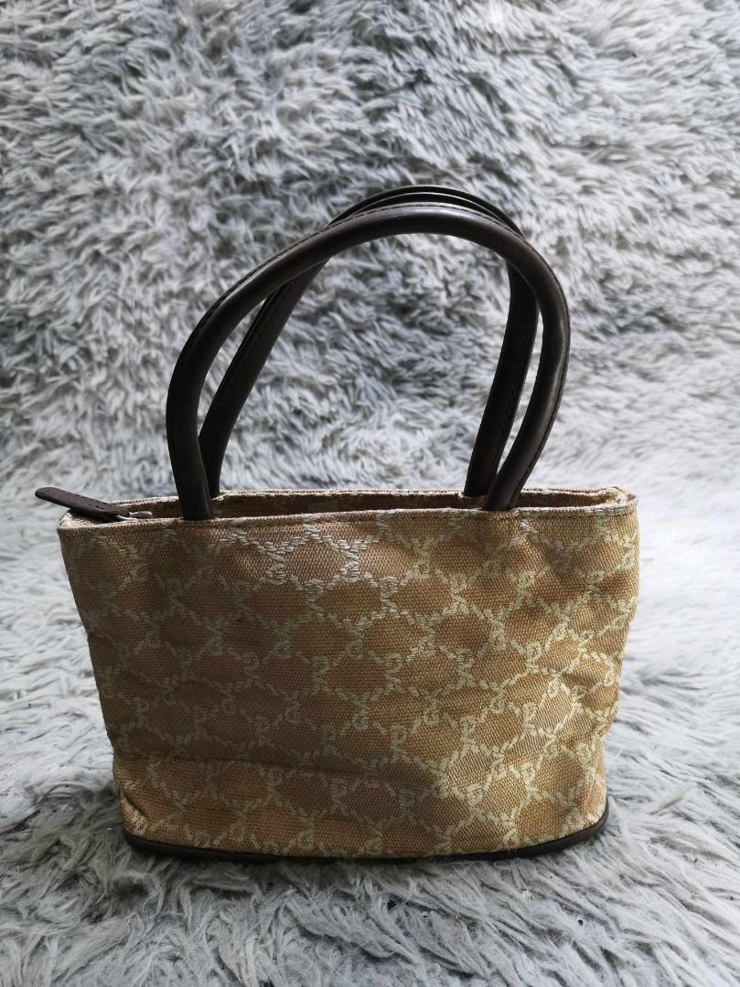 Beige Monogram Mini Tote Bag With Dark Top Handles (Category: Purses & Pouches) located in Santa Cruz. Submitted by jmy_surplus.2 (Listing ID 1462705377, Image 1). Description: Size ; L - 6 W - 9.2 Color ; Beige Type ; Tote Bag Brand ; No brand Material ; Synthetic Style ; Beige Mini Tote Bag LR 129 JMY 5 Batch #222.
