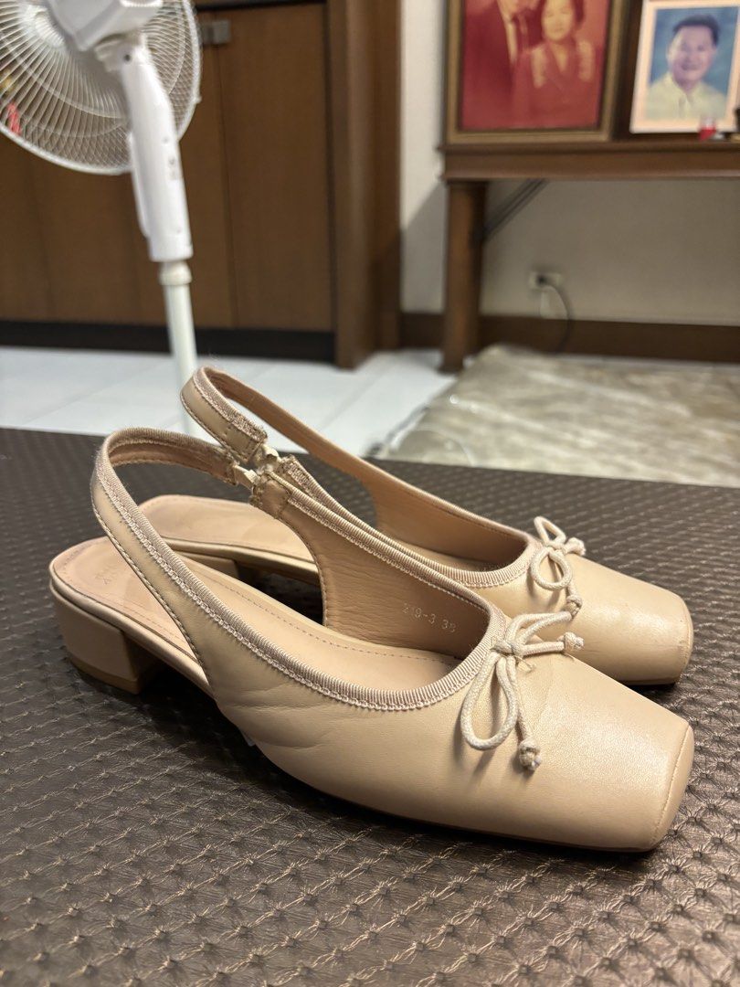 Beige Slingback Flats with Bow Detail (Category: Flats & Sandals) located in Paranaque City. Submitted by corinne_see (Listing ID 1462849966, Image 2). Description: - Cute beige slingback flats - Stylish square toe design - Adorable bow detail on the front - Secure slingback strap with buckle closure - Comfortable low block heel - Versatile and easy to pair with any outfit - Ideal for casual wear.