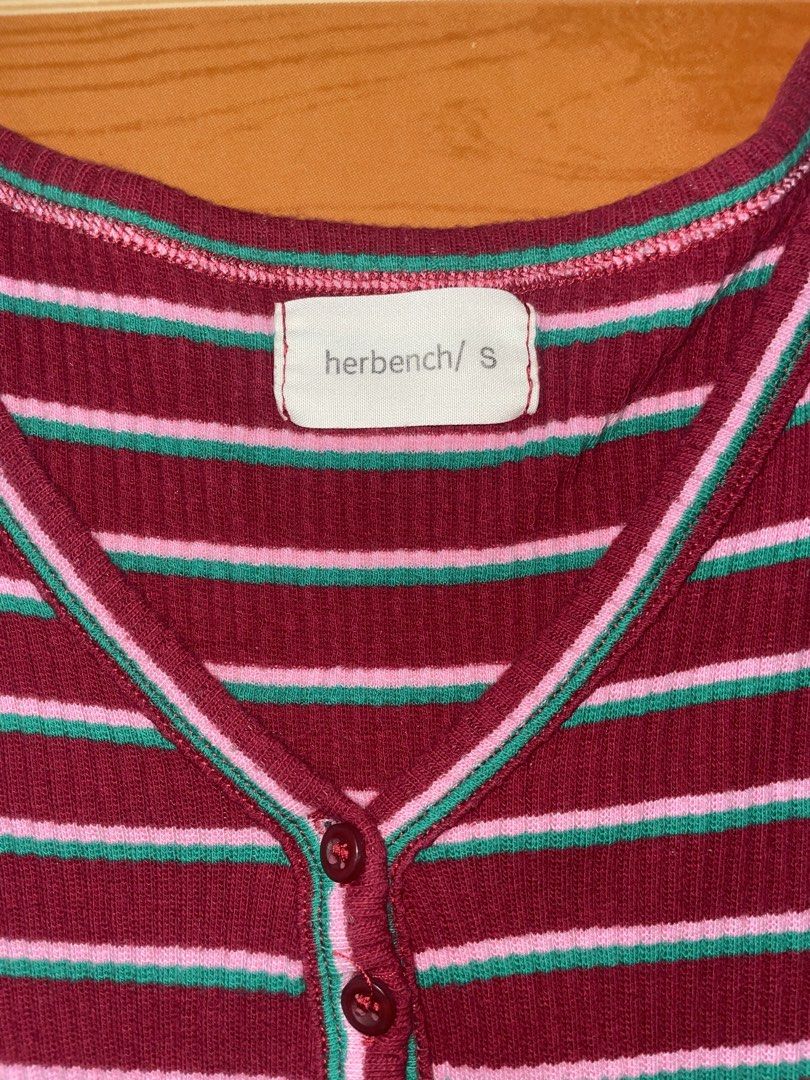BENCH short-sleeve ribbed henley top (s) (Category: Shirts) located in Cavite. Submitted by heyitsmissy (Listing ID 1462854424, Image 2). Description: - BENCH Maroon ribbed henley top - Size: Small - Color: Maroon with horizontal pink and teal stripes - Features: Short sleeves, button-up neckline - Style: Casual wear.