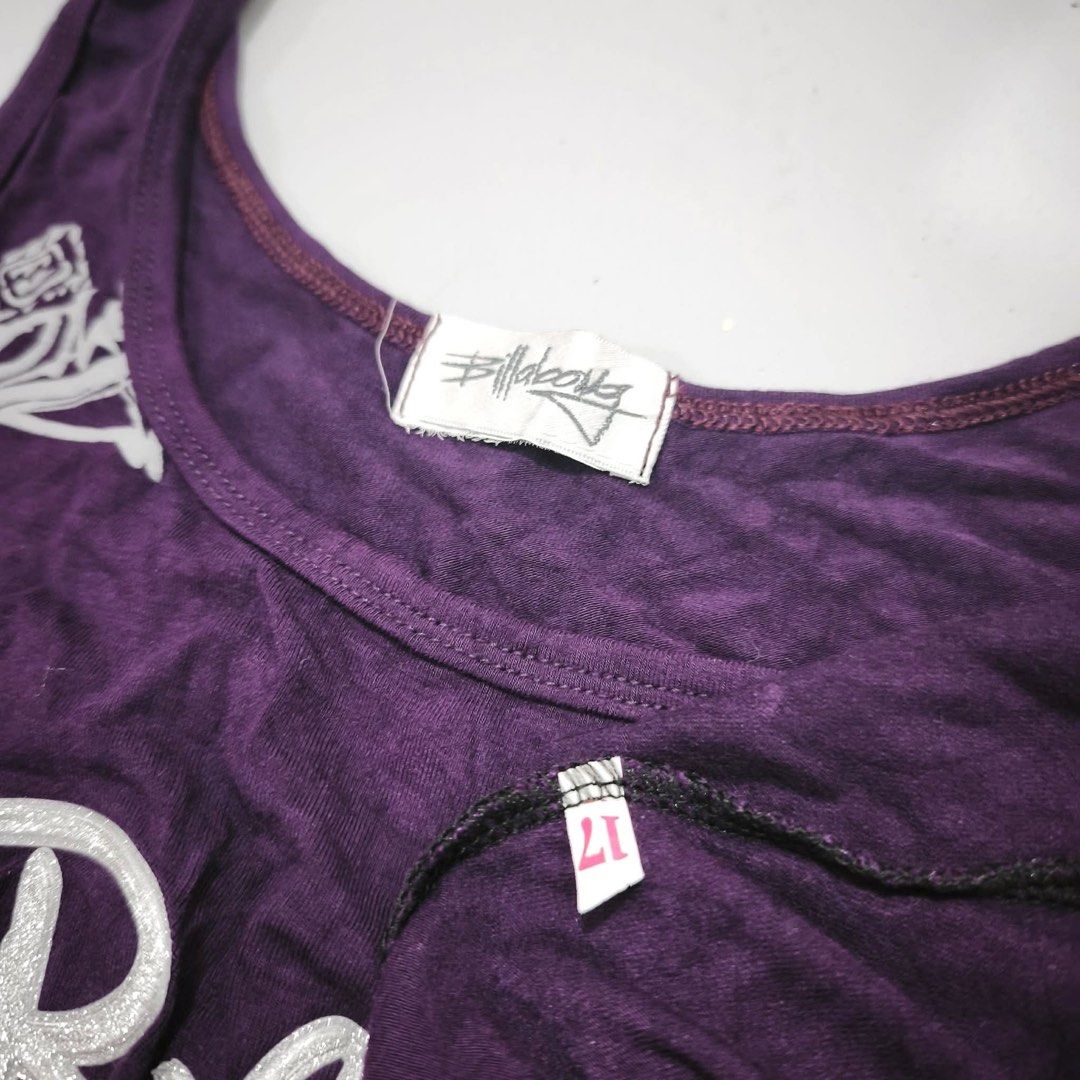 Billabong Purple Graphic Tank Top (Category: Sleeveless) located in Manila. Submitted by rayuki39 (Listing ID 1462819017, Image 2). Description: - Brand: Billabong - Color: Purple - Style: Tank top - Features: Cool graphic print, Billabong logo, 'new collection' text - Occasion: Casual wear.