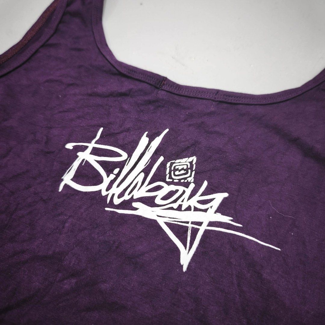 Billabong Purple Graphic Tank Top (Category: Sleeveless) located in Manila. Submitted by rayuki39 (Listing ID 1462819017, Image 3). Description: - Brand: Billabong - Color: Purple - Style: Tank top - Features: Cool graphic print, Billabong logo, 'new collection' text - Occasion: Casual wear.