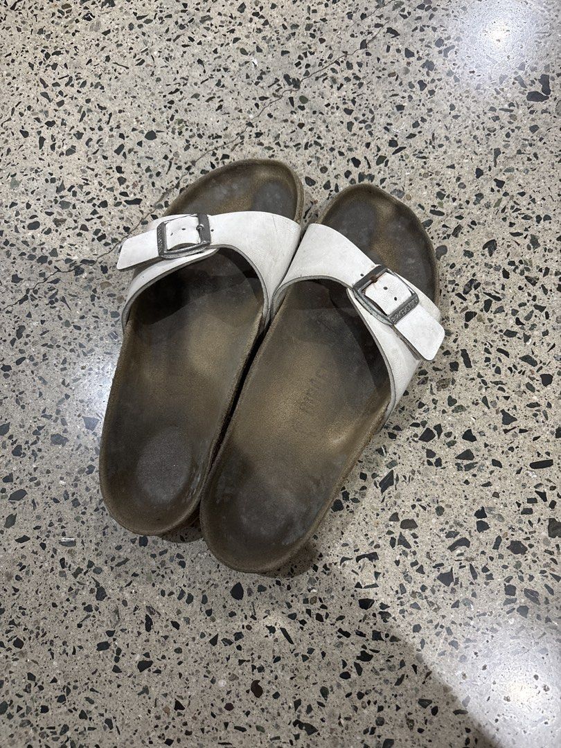 Birkenstocks size 35 (Category: Flats & Sandals) located in Manila. Submitted by everythingwlove (Listing ID 1462819243, Image 1). Description: - White leather Birkenstock sandals - Comfortable cork footbed - Adjustable buckle closure - Soles show some wear - Ideal for everyday comfort.