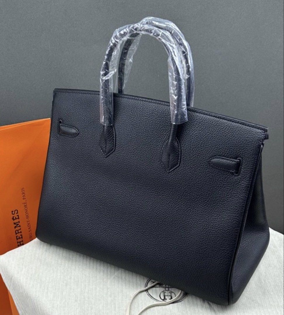 Birkin Togo 35 Palladium (Category: Luxury Bags & Wallets) located in Muntinlupa City. Submitted by decluttering.era.alabang (Listing ID 1462834168, Image 1). Description: - Classic black Hermes Birkin bag - Textured leather exterior - Silver hardware details - Top handles and flap closure - Comes with dust bag and orange Hermes box .
