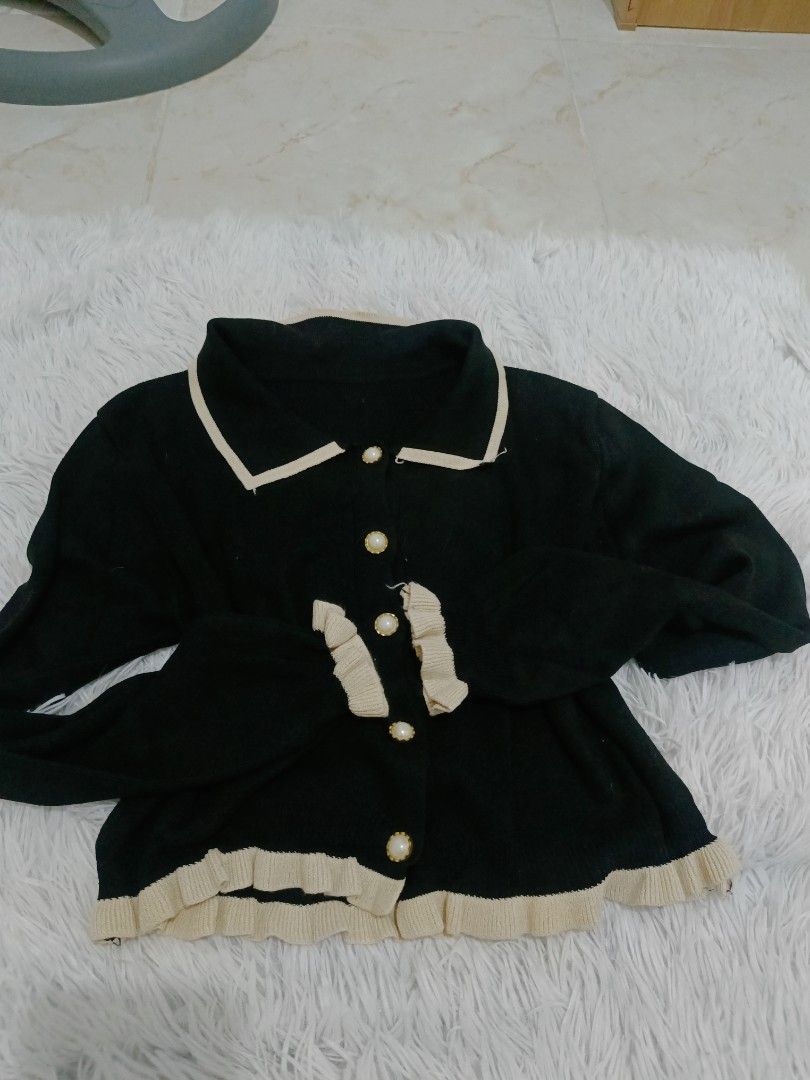 Black & Cream Ruffle Collar Button Up Cardigan (Category: Coats, Jackets and Outerwear) located in Malolos. Submitted by zoefunzy.yyy (Listing ID 1462863782, Image 2). Description: - Cute black cardigan - Cream trim and ruffles - Pearl-like buttons down the front - Cream trim on collar - Ruffle details on cuffs and hem - Great for layering.