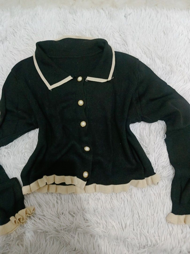 Black & Cream Ruffle Collar Button Up Cardigan (Category: Coats, Jackets and Outerwear) located in Malolos. Submitted by zoefunzy.yyy (Listing ID 1462863782, Image 1). Description: - Cute black cardigan - Cream trim and ruffles - Pearl-like buttons down the front - Cream trim on collar - Ruffle details on cuffs and hem - Great for layering.