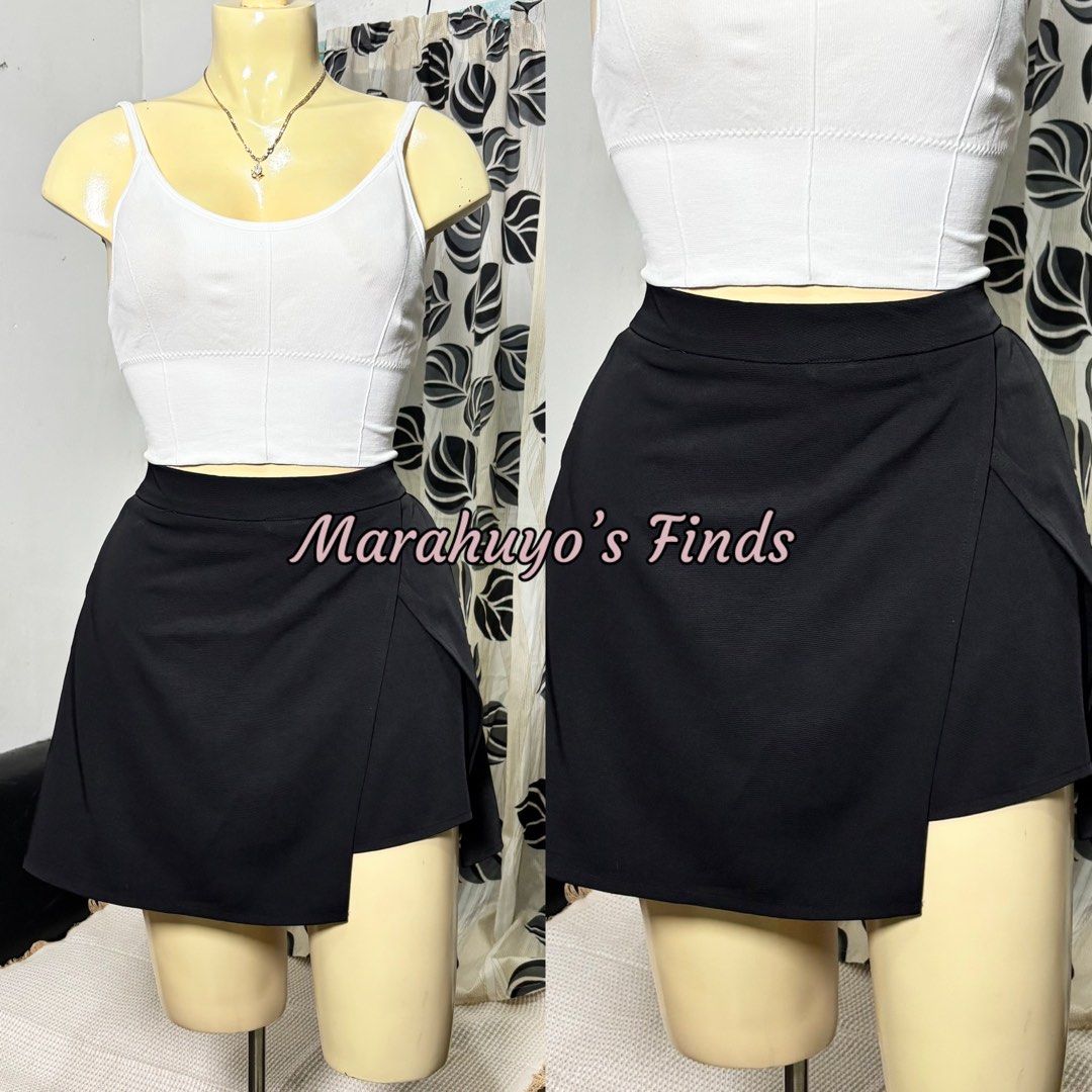 Black Asymmetrical Wrap Skirt (Category: Skirts) located in Mabalacat. Submitted by marahuyos.finds (Listing ID 1462848459, Image 2). Description: - Cute black asymmetrical wrap skirt - Versatile for casual or dressy outfits - Pairs well with crop tops or t-shirts - Comfortable waistband - Nice fabric texture - Easy to style.