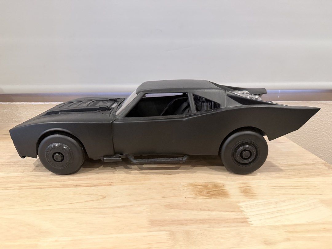 Black Batmobile Toy Car Model (Category: Vehicle & Diecast Models) located in Cebu City. Submitted by TheSunshineShop (Listing ID 1462779409, Image 1). Description: - 4 pcs: 790 each size: length: 22-23inches, width: 9.5 inches Sleek black toy car, reminiscent of the Batmobile. - Features a detailed engine sculpted at the back. - Constructed from durable plastic. - Ideal for toy car collectors or as a display piece..