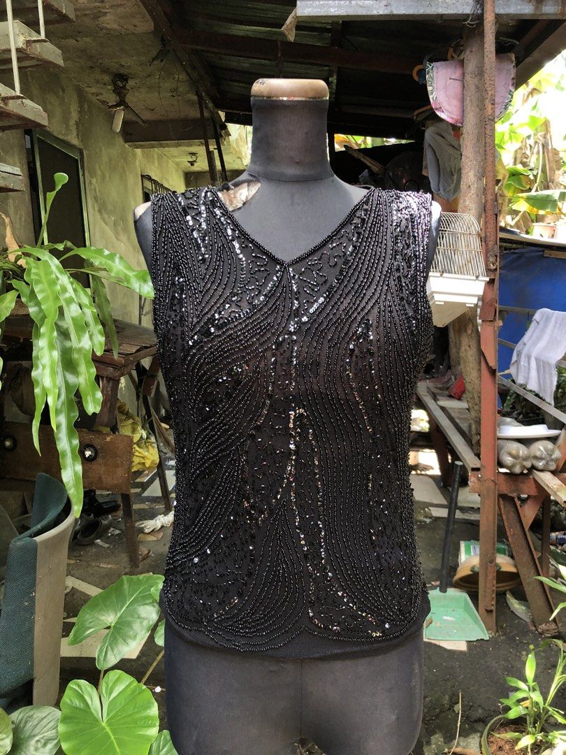 Black Beaded Sleeveless V-Neck Top (Category: Sleeveless) located in Manila. Submitted by pinay2000sfinds (Listing ID 1462682676, Image 1). Description: - Stunning black sleeveless top - Intricately covered in beads and sequins - Flattering V-neckline - Ideal for parties, events, or a night out - Estimated size: Small to Medium - Eye-catching and unique design.