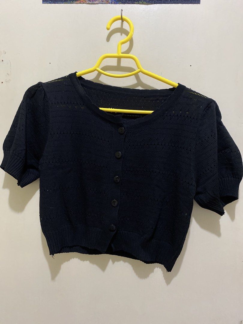 Black Cropped Button-Up Cardigan with Puff Sleeves (Category: Coats, Jackets and Outerwear) located in Pasig City. Submitted by alaineeeee (Listing ID 1462772712, Image 1). Description: - Black cropped cardigan - Short puff sleeves - Button-up front - Textured knit with cut-out details - Versatile: wear open or closed - Ideal for layering over tops or dresses.
