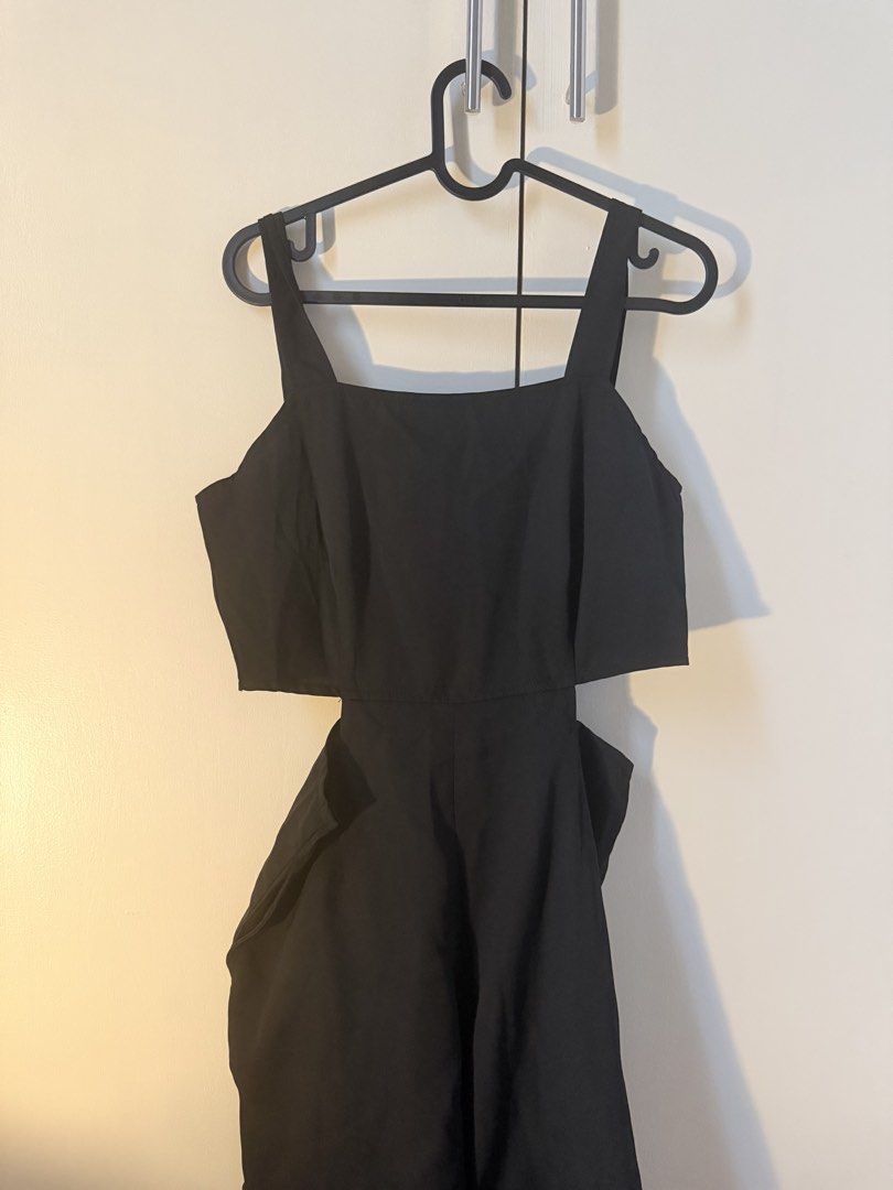 Black Cut-Out Jumpsuit with Square Neckline (Category: Jumpsuits) located in Manila. Submitted by audreyyyy9 (Listing ID 1462792998, Image 1). Description: - Elegant black jumpsuit - Flattering square neckline - Stylish side cut-out details - Comfortable wide-leg silhouette - Functional pockets - Versatile for night outs or special occasions - Easy to dress up or down.