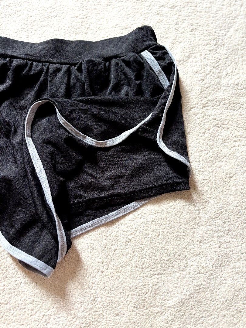 Black Dolphin Shorts with White Trim (Category: Shorts) located in Cadiz. Submitted by soleil_montefalco (Listing ID 1462832288, Image 2). Description: - Comfy black dolphin shorts - White trim along edges - Elastic waistband for a good fit - Ideal for lounging or workouts - Versatile: easy to pair with any top -Sizes are just being estimated please do expect some discrepancy. - NO RETURN & CANCELATION OF ORDERS -Color may vary due to lighting..