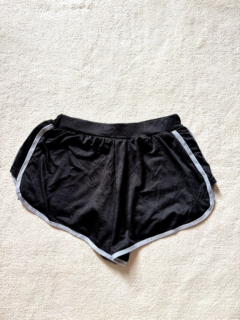 Black Dolphin Shorts with White Trim (Category: Shorts) located in Cadiz. Submitted by soleil_montefalco (Listing ID 1462832288, Image 1). Description: - Comfy black dolphin shorts - White trim along edges - Elastic waistband for a good fit - Ideal for lounging or workouts - Versatile: easy to pair with any top -Sizes are just being estimated please do expect some discrepancy. - NO RETURN & CANCELATION OF ORDERS -Color may vary due to lighting..