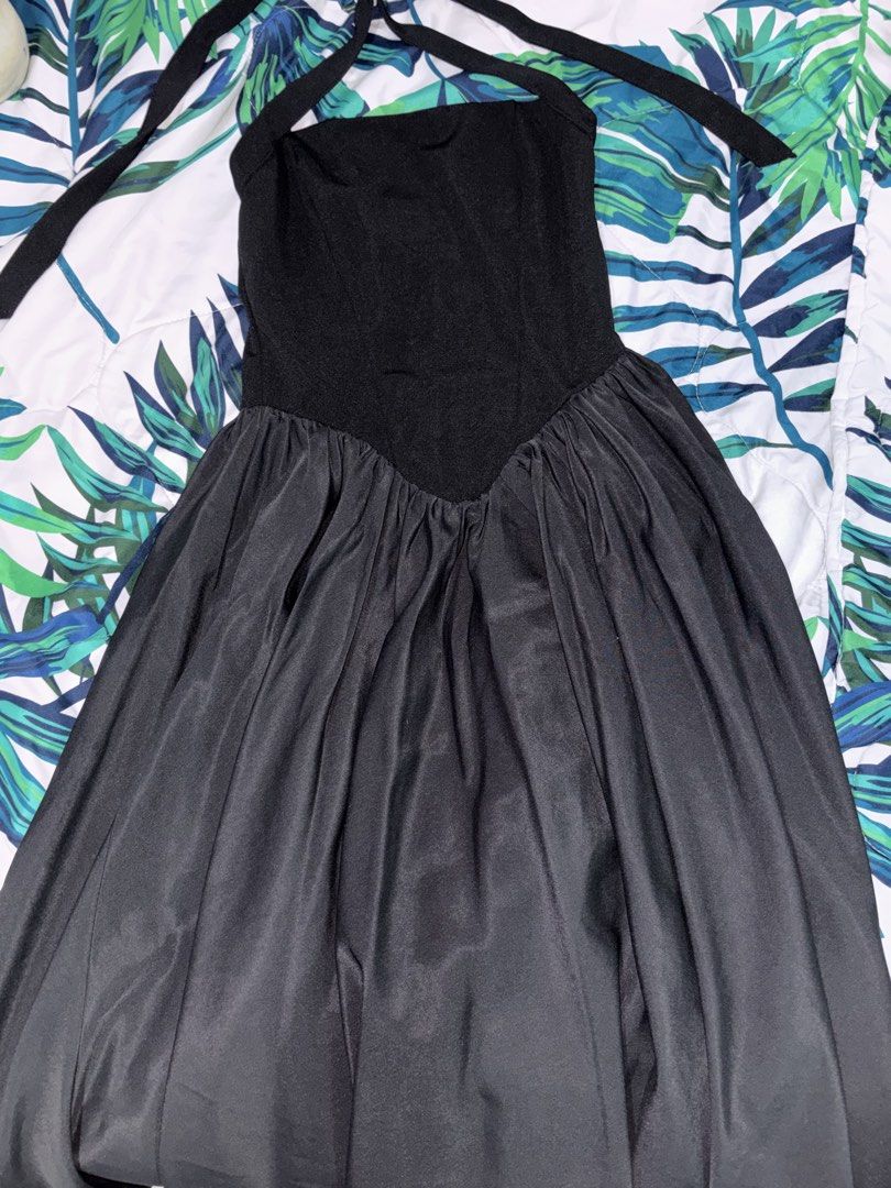 Black Halter Neck Maxi Dress (Category: Dresses) located in Manila. Submitted by beelvrd (Listing ID 1462782357, Image 1). Description: - Black halter neck maxi dress - Fitted top with a flowy skirt - Ties at the neck for adjustable fit - Satin-like finish on the skirt - Free size - Worn once.