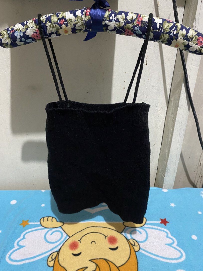 Black Knit Cropped Top with Spaghetti Straps (Category: Sleeveless) located in Manila. Submitted by resi.diaz (Listing ID 1462844491, Image 1). Description: - size approximately XS to S. - Black knit cropped top - Features thin spaghetti straps - Textured knit material - Ribbed hem - Versatile for layering or wearing on its own.
