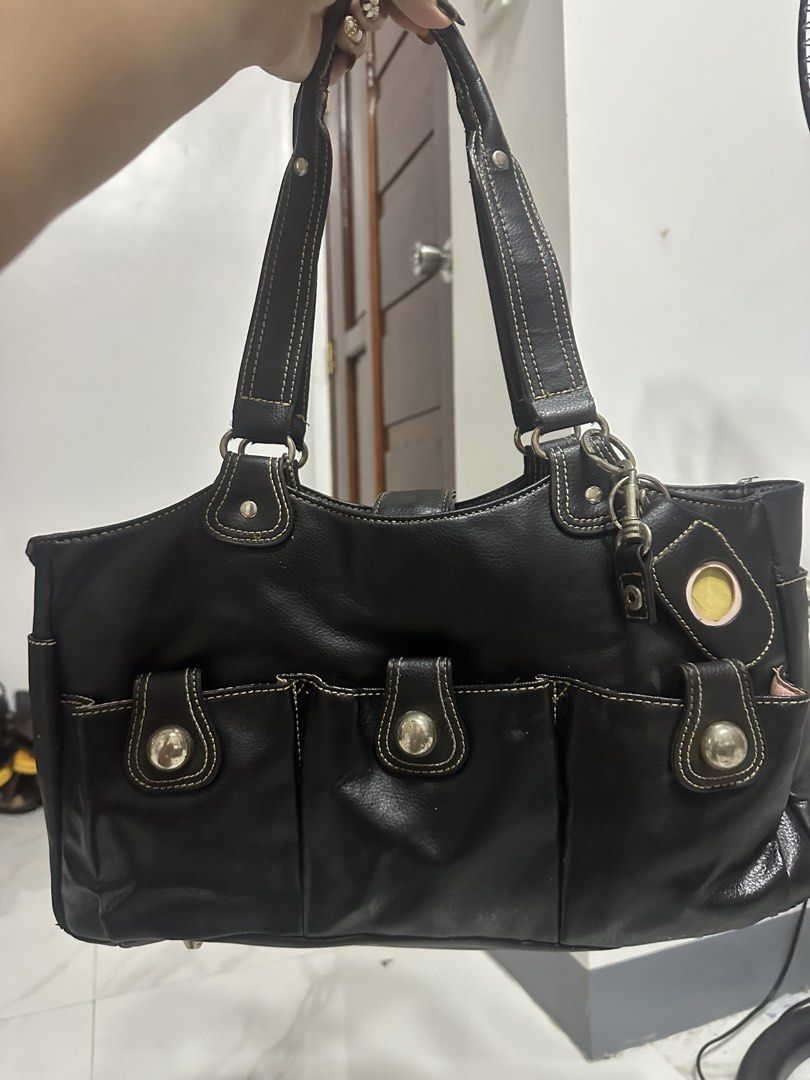 Black Leather AMM Handbag with Multiple Pockets (Category: Luxury Bags & Wallets) located in Manila. Submitted by goldenhorse-dafc (Listing ID 1462839913, Image 1). Description: - AMM black leather handbag - Multiple front pockets with snap closures - Interior features pink lining and several compartments - Leather straps with contrast stitching - Stylish and perfect for everyday use - Please check photos for detailed condition.