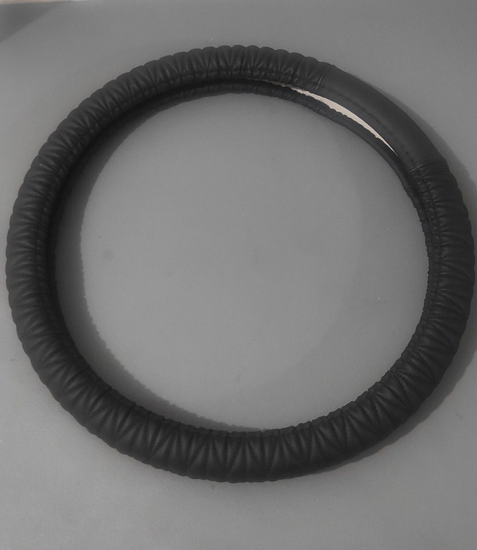 Black Leather Steering Wheel Cover (Category: Other Automotive Parts and Accessories) located in San Juan City. Submitted by master_aga.criket (Listing ID 1462841378, Image 1). Description: - Made of durable leather - Textured grip for better control - Fits most standard steering wheels - Simple and easy installation - Upgrades your car's interior feel.