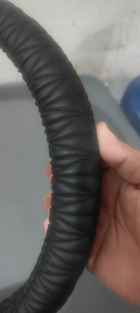 Black Leather Steering Wheel Cover (Category: Other Automotive Parts and Accessories) located in San Juan City. Submitted by master_aga.criket (Listing ID 1462841378, Image 2). Description: - Made of durable leather - Textured grip for better control - Fits most standard steering wheels - Simple and easy installation - Upgrades your car's interior feel.