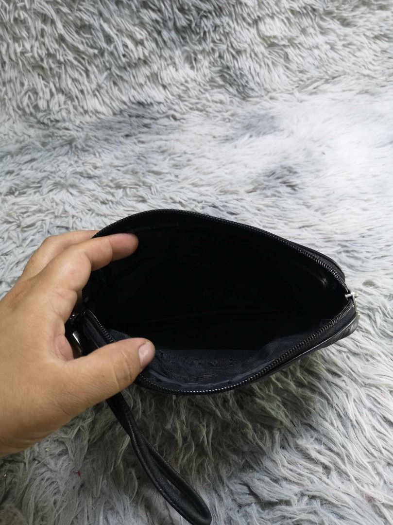 Black leather Zipper Closure Wrist Strap Wristlet (Category: Belt bags, Clutches and Pouches) located in Santa Cruz. Submitted by jmy_surplus.2 (Listing ID 1462793664, Image 2). Description: Size ; L - 6 W - 8.6 Color ; Black Type ; Wristlet Brand ; No brand Material ; Leather Style ; Black leather Wristlet LR 129 JMY 5 Batch #222.