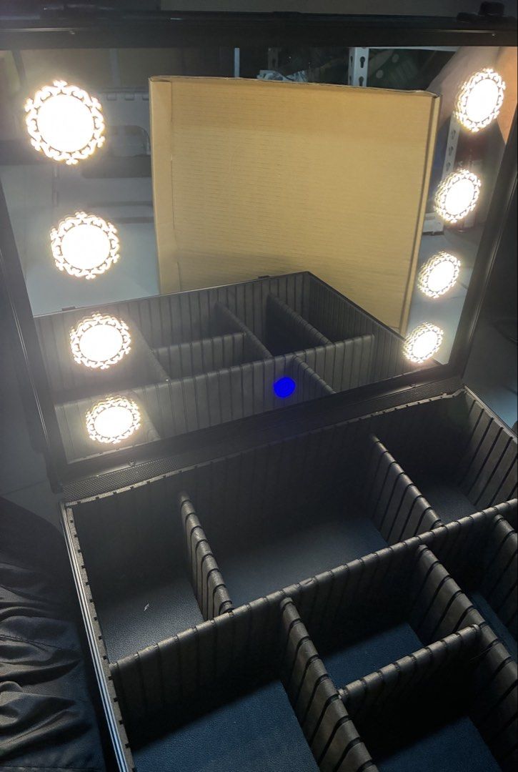 Black Makeup Case with Mirror and Lights (Category: Makeup) located in Manila. Submitted by jhie24 (Listing ID 1462866402, Image 2). Description: Negotiable!!! - Sleek black makeup case - Built-in mirror with bright LED lights - Multiple compartments for organized storage - Durable construction with secure latches - Convenient handle for portability - Ideal for professional makeup artists and personal use - Enhances application with illuminated w