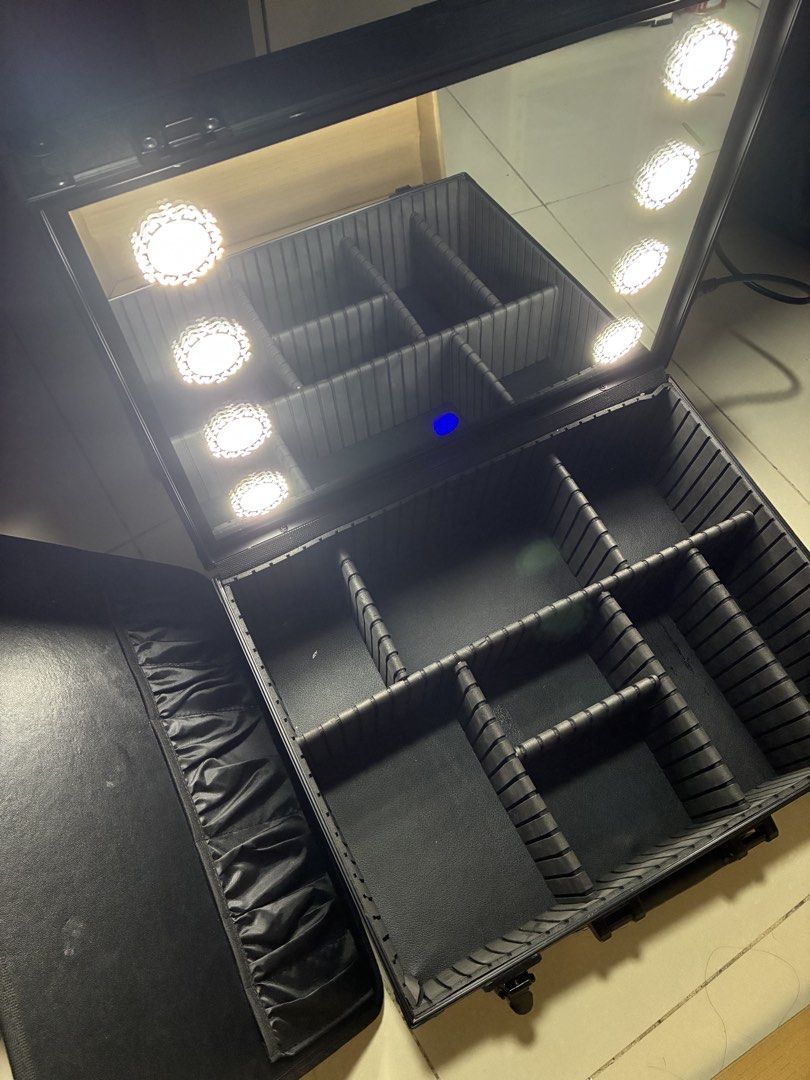 Black Makeup Case with Mirror and Lights (Category: Makeup) located in Manila. Submitted by jhie24 (Listing ID 1462866402, Image 1). Description: Negotiable!!! - Sleek black makeup case - Built-in mirror with bright LED lights - Multiple compartments for organized storage - Durable construction with secure latches - Convenient handle for portability - Ideal for professional makeup artists and personal use - Enhances application with illuminated w