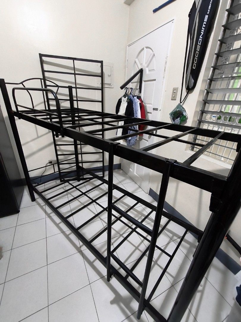 Black Metal Bunk Bed Frame with pull out (negotiable) (Category: Bed Frames & Mattresses) located in Manila. Submitted by tiktok_hellobloom.careteam (Listing ID 1462740321, Image 1). Description: - Sturdy black metal bunk bed frame - Includes ladder and guard rails for top bunk - Strong and durable construction - Fits two single mattresses - Disassembled for easy transport - Ideal for saving space.