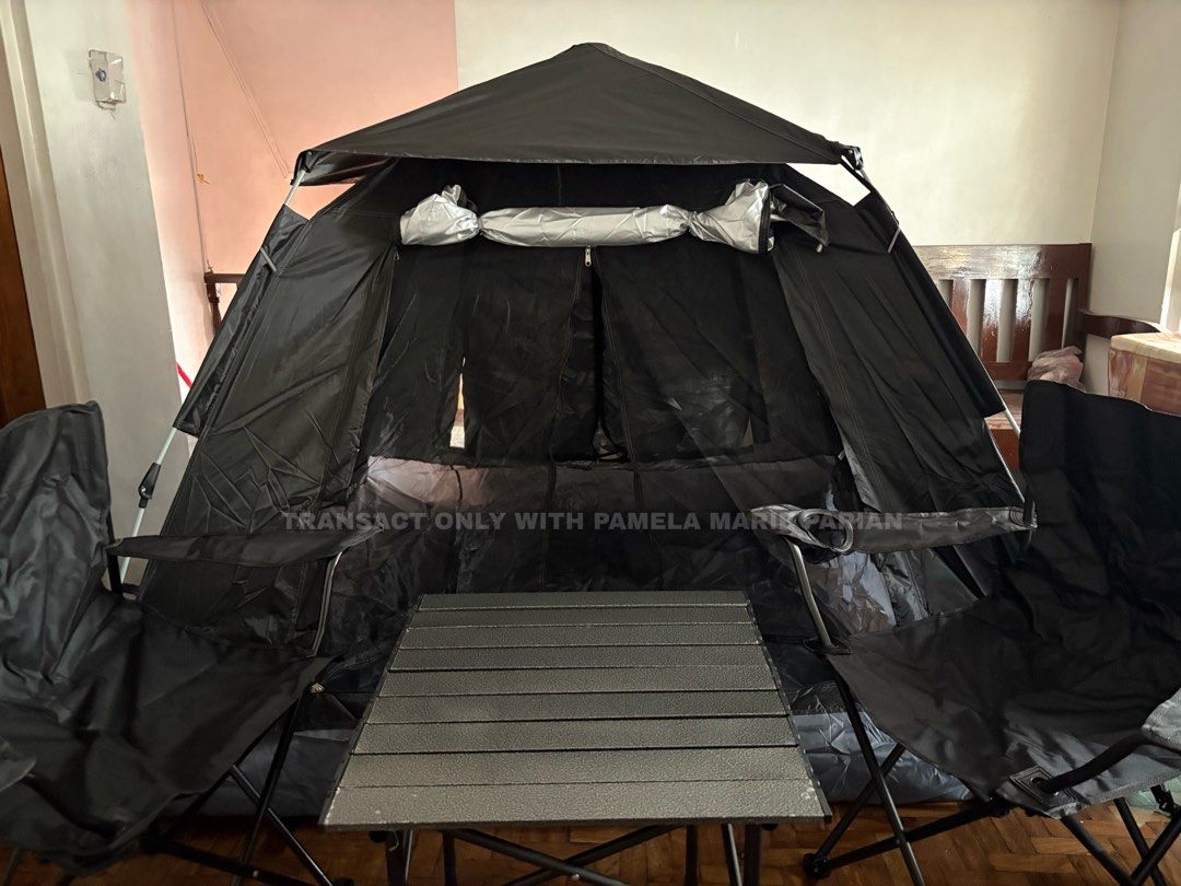 Black Pop-Up Tent with Table and Chairs (Category: Outdoor Furniture) located in Las Pinas. Submitted by phamyyy15 (Listing ID 1462720516, Image 1). Description: 1,450 tent only 2,450 tent, table and chairs - Easy to set up black pop-up tent - Includes foldable table and two chairs - Ideal for camping trips or outdoor gatherings - Spacious interior for comfort - Dark color provides privacy - Ready for your next adventure.