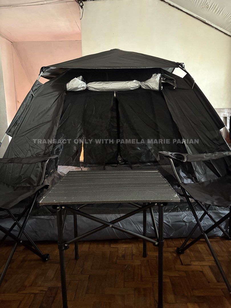 Black Pop-Up Tent with Table and Chairs (Category: Outdoor Furniture) located in Las Pinas. Submitted by phamyyy15 (Listing ID 1462720516, Image 3). Description: 1,450 tent only 2,450 tent, table and chairs - Easy to set up black pop-up tent - Includes foldable table and two chairs - Ideal for camping trips or outdoor gatherings - Spacious interior for comfort - Dark color provides privacy - Ready for your next adventure.