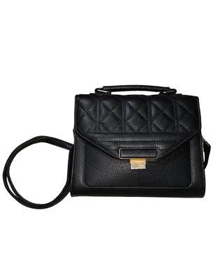 Black Quilted Handbag with Gold Clasp (Category: Luxury Bags & Wallets) located in Mandaluyong City. Submitted by declutterwme.709 (Listing ID 1462786127, Image 1). Description: Black leather handbag with quilted top flap. Includes a long strap Spacious interior, ideal for everyday needs or evening events Bought in 2024 RFS - Decluttering.