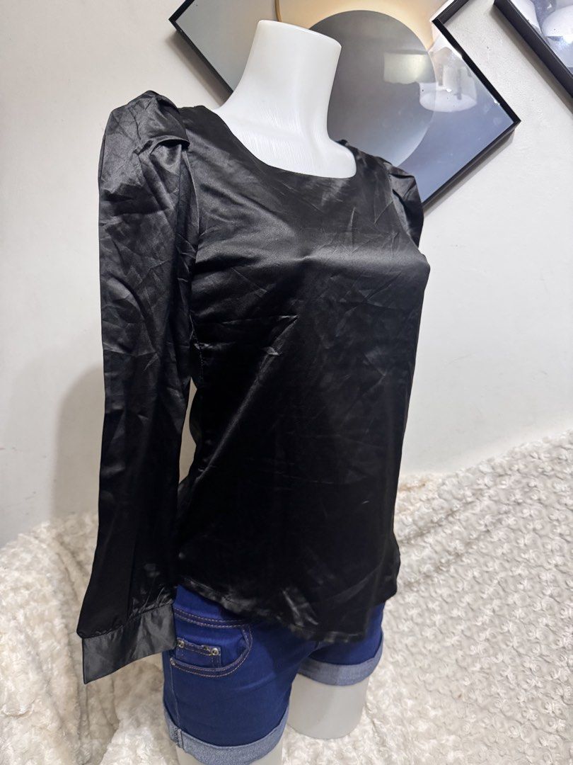 Black Satin Puff Sleeve Top (Category: Blouses) located in Marikina City. Submitted by lorradel (Listing ID 1462728680, Image 2). Description: - Med on tag but fits Small - Elegant black satin long sleeve top - Features stylish puff sleeves at the shoulders - Flattering square neckline - Cuffs at the wrists for a polished look - Beautiful fabric with a nice sheen - Versatile piece: pairs perfectly with jeans or skirts - MAY HAVE some washable sta