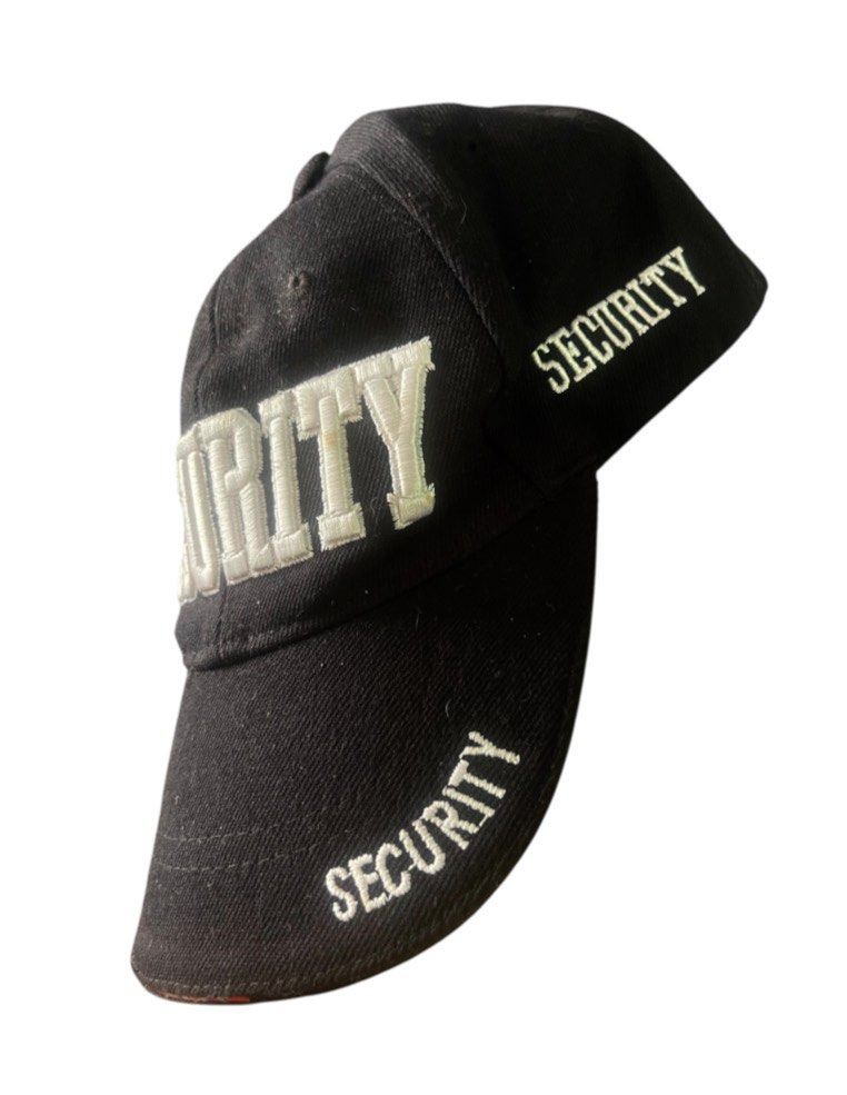 Black Security Embroidered Baseball Cap (Category: Caps & Hats) located in San Pedro. Submitted by lifebeginsaftercoff33 (Listing ID 1462724934, Image 2). Description: - Black baseball cap - 'SECURITY' embroidered on front and side - Adjustable velcro strap at the back - 'UNI ACE' printed lining - Ideal for security work or costumes - Size: OS.