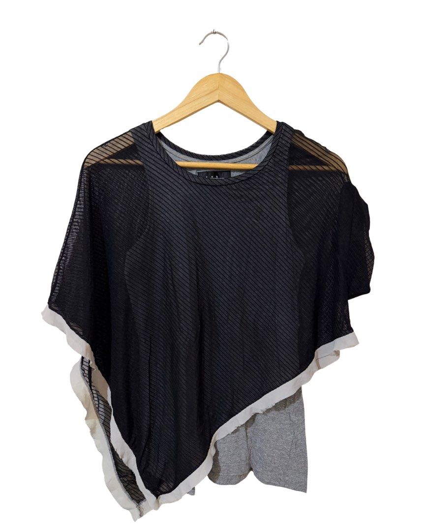 Black Sheer Overlay Asymmetrical Top (Category: Blouses) located in Subic. Submitted by ciesells (Listing ID 1462862292, Image 1). Description: bust: 36-39 - With grey inner layer - Unique asymmetrical hemline with raw edge detail - Small hole on sheer fabric (visible in close-up photos).
