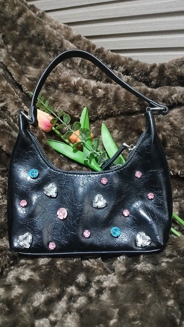 Black shoulder bag with rhinestones (Category: Shoulder Bags) located in Taguig. Submitted by jegadablo (Listing ID 1462743363, Image 1). Description: - Cute black shoulder bag - Decorated with colorful rhinestones - Single strap - Zipper closure - Ideal for a night out or adding sparkle to your outfit.