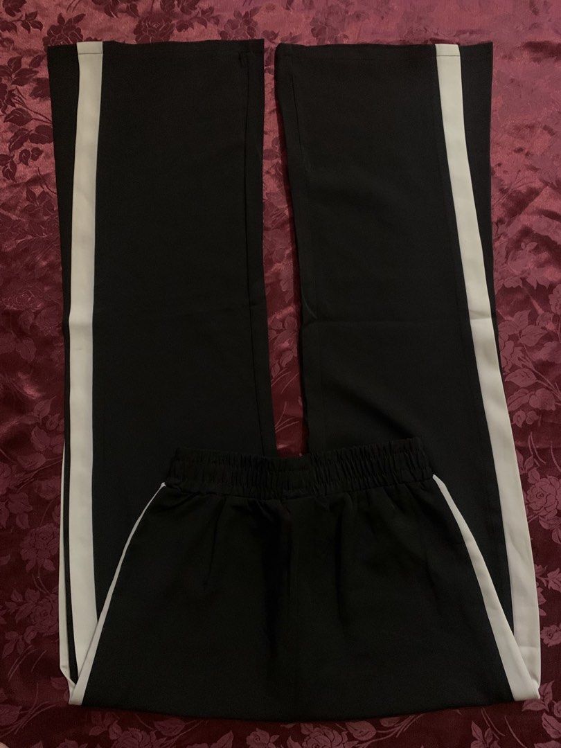 Black Side Stripe Wide Leg Style Pants (Category: Other Bottoms) located in Quezon City. Submitted by cheann_ (Listing ID 1462875502, Image 1). Description: ~waistline 11” ~length 40” ~style: wide leg ~stretch ~best fits: XXS/XS or petite frame •Details: High-rise look, sporty chic vibe .