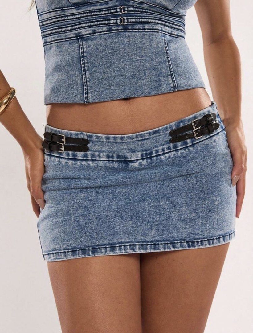Blue Denim Halter Top & Mini Skirt Set (Category: Sets or Coordinates) located in Villasis. Submitted by juliaxgamboa (Listing ID 1462844234, Image 3). Description: - Cute blue denim halter top and matching mini skirt - Halter neck ties at the back - Top features a fitted bodice with a peplum hem - Skirt has a low-rise waist with buckle details - Ideal for a night out or festival look - Strong Y2K aesthetic.