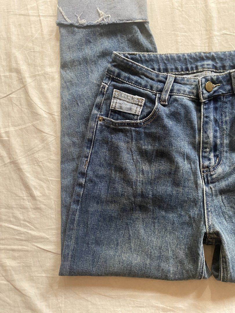Blue Denim Mom Jeans with Cuffed Hems (Category: Jeans) located in Manila. Submitted by yannaapril (Listing ID 1462732701, Image 3). Description: Stone Wash High Rise Mom Jeans Cuffed Hem Measurements: (inches) Waist - 26 Hips - 34 Length/outseam - 37 - Straight leg cut for a comfortable fit - Cuffed hem with distressed, frayed edge - Front button and zip closure - Two back pockets - Ideal for everyday casual wear.