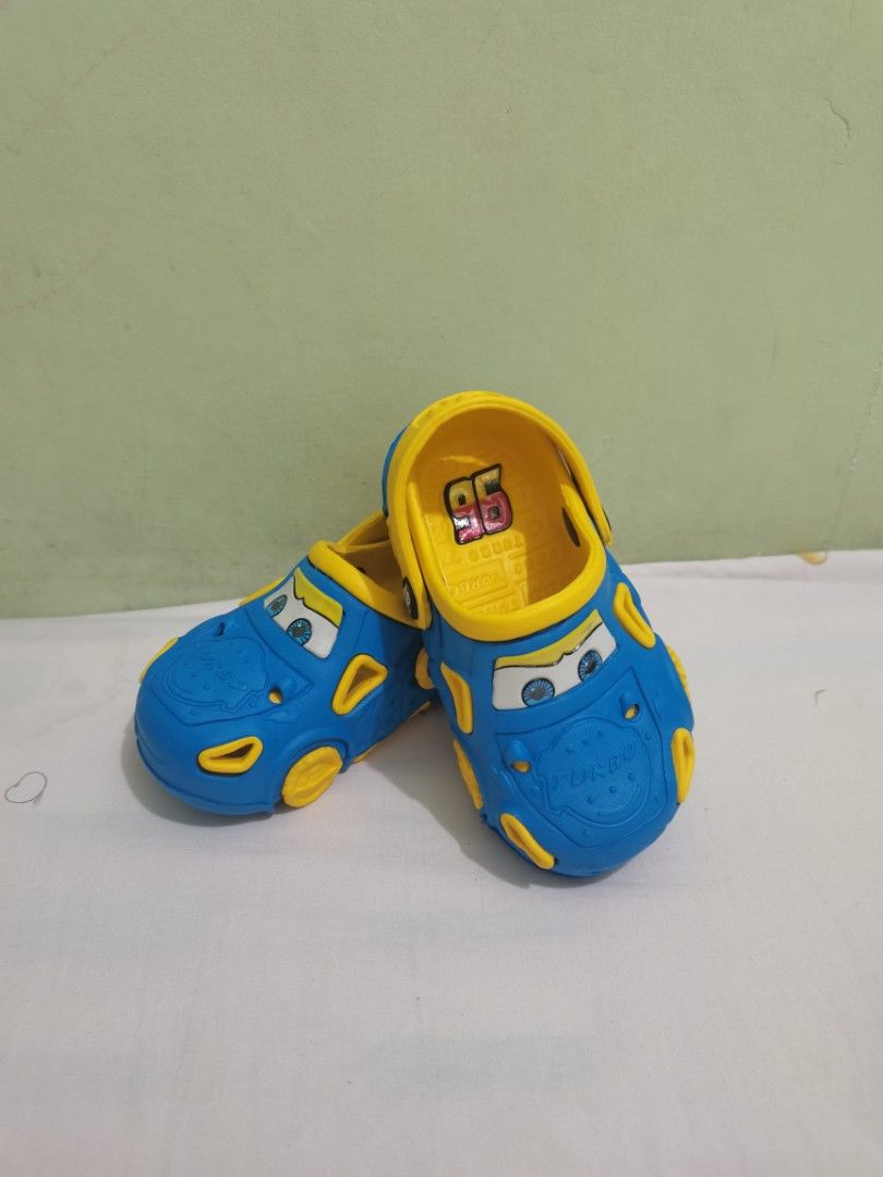 Blue Lightning McQueen Car Clogs for Kids (Category: Babies & Kids Fashion) located in Valenzuela. Submitted by nafie330 (Listing ID 1462705942, Image 3). Description: -size 25 - Adorable blue clogs designed like Lightning McQueen from Cars! - Features yellow accents and the iconic number 96. - Sturdy soles with excellent grip for safe play. - Effortless slip-on and slip-off design for kids. - Perfect for playtime, beach trips, or everyday casual