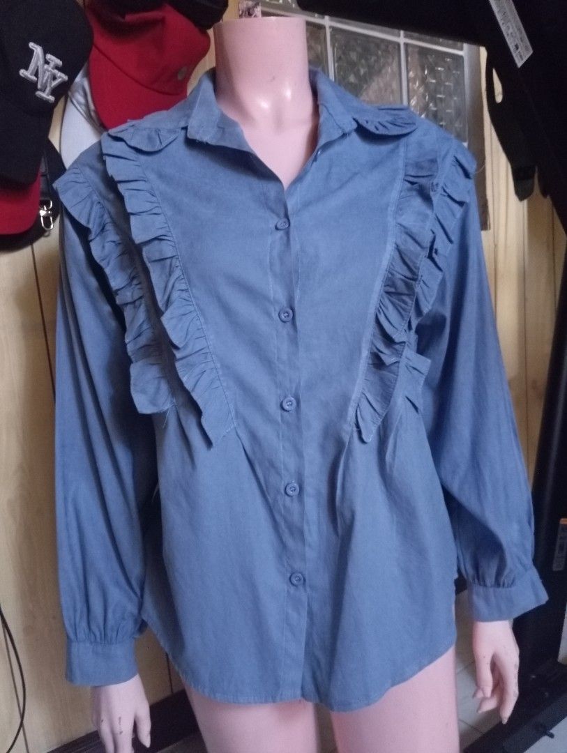 Blue Ruffled Long Sleeve Button Up Blouse (Category: Blouses) located in Cebu City. Submitted by smnthdanielle (Listing ID 1462882727, Image 2). Description: - Cute blue blouse - Ruffles down the front - Long sleeves with elastic cuffs - Button-up front - Easily styled for casual or dressy looks - Perfect for everyday wear.