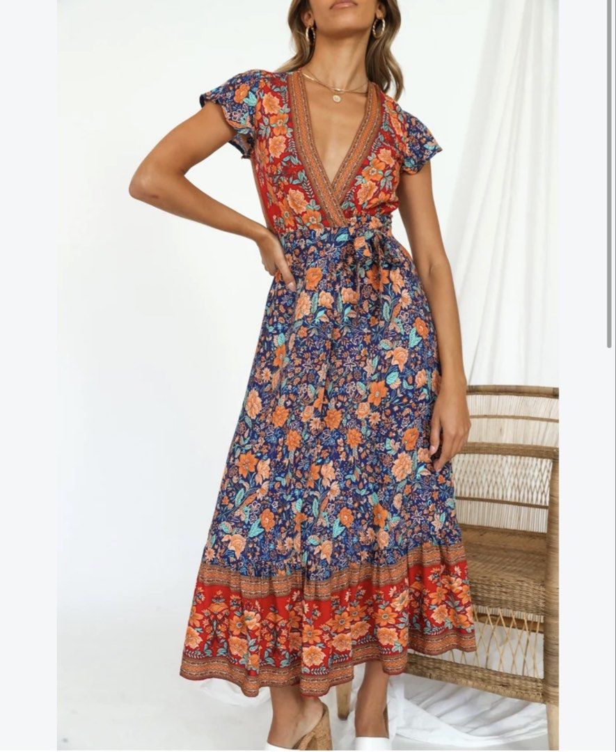 Boho Floral Wrap Maxi Dress (Category: Dresses) located in Quezon City. Submitted by hereshecams (Listing ID 1462715997, Image 1). Description: - Boho style maxi dress - Vibrant floral print - Flattering wrap design - Short flutter sleeves - Adjustable tie waist for a comfortable fit - Perfect for casual outings or beach vacations - Can be dressed up or down.