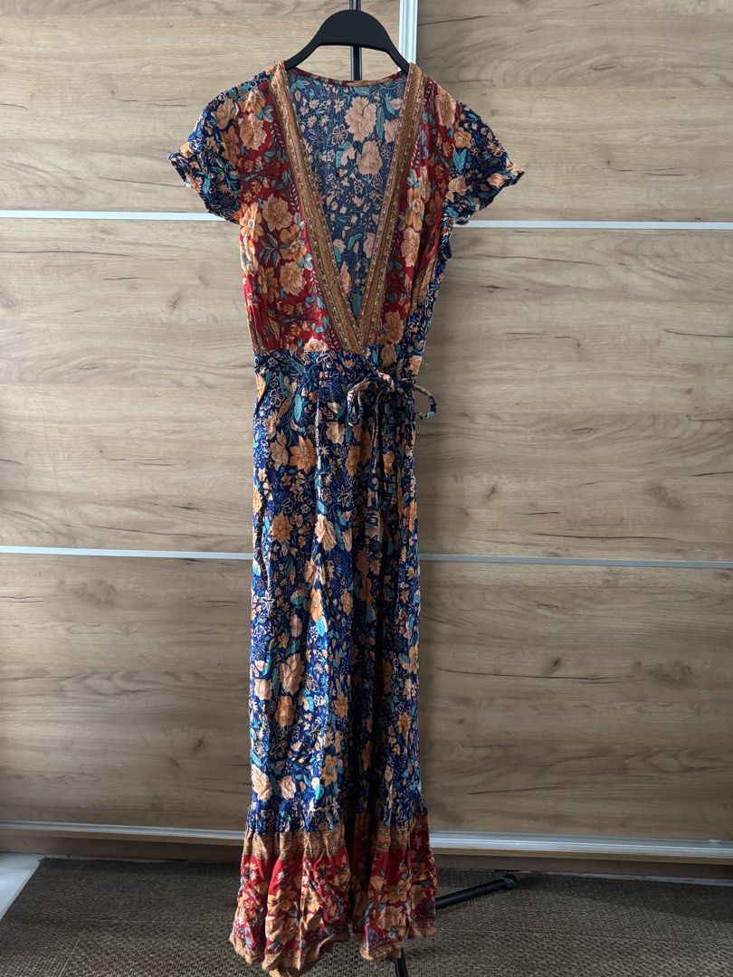 Boho Floral Wrap Maxi Dress (Category: Dresses) located in Quezon City. Submitted by hereshecams (Listing ID 1462715997, Image 3). Description: - Boho style maxi dress - Vibrant floral print - Flattering wrap design - Short flutter sleeves - Adjustable tie waist for a comfortable fit - Perfect for casual outings or beach vacations - Can be dressed up or down.