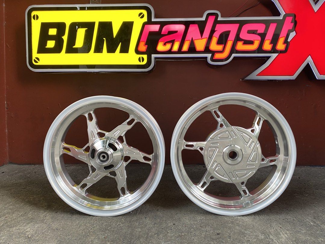 BomX Mags For Click & Fazzio (Category: Tires & Rims) located in Manila. Submitted by althealopez_dragon (Listing ID 1462748361, Image 2). Description: Onhand BomX Mags‼️ BOM RANGSIT CNC MAGS Bom X Hexa Mags Fazzio 12s Bom X Star Mags Click 125/150 Location: Pateros, Metro Manila Waze: Palaboy Backyards Works Motor Shop 📩 Send us a message for any inquiries. 📞 +63 9168557562.