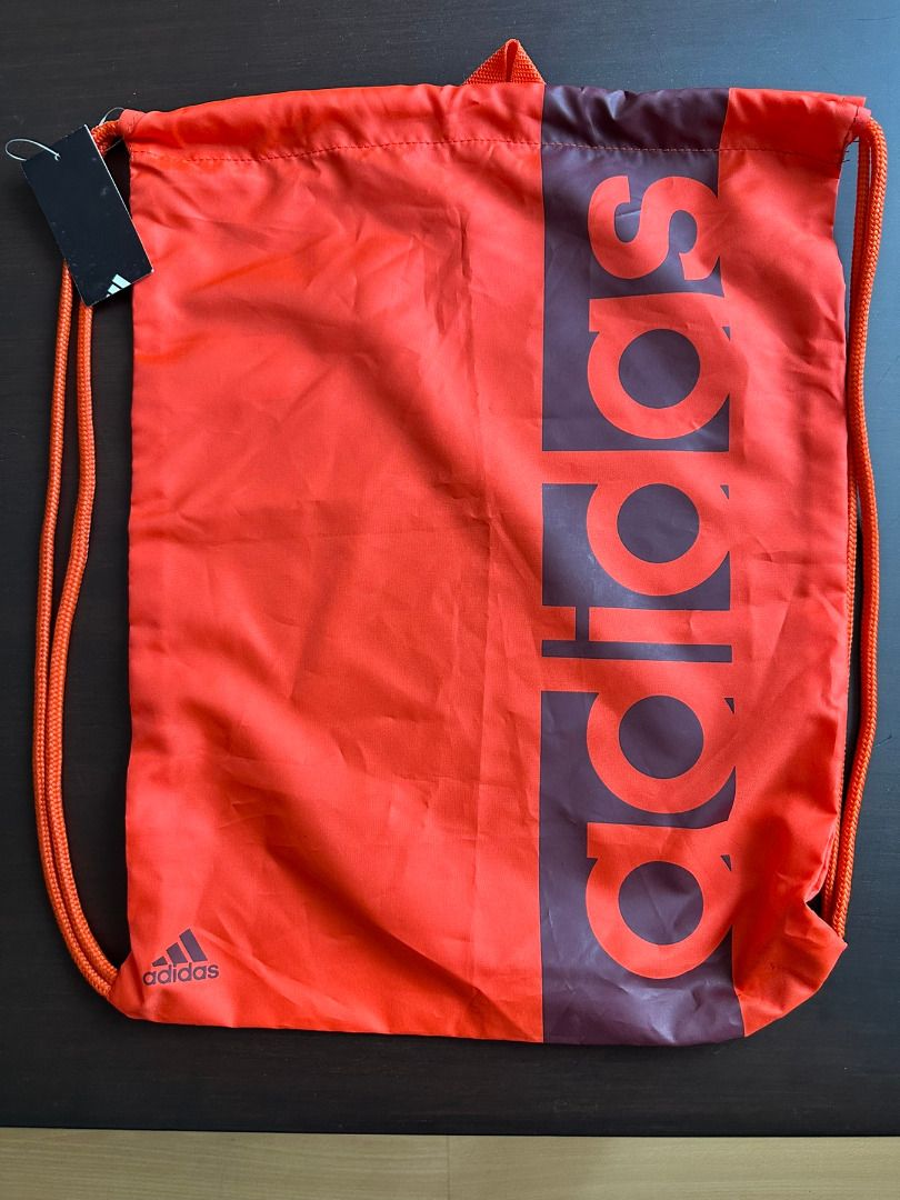 [BRAND NEW] Adidas Orange Drawstring Bag with Tag (Category: Backpacks) located in Quezon City. Submitted by ritageneralgoods (Listing ID 1462695186, Image 1). Description: Adidas Orange Drawstring Bag with Tag Condition: Brand new with tag RFS: decluttering MOP: Gcash or bank transfer. No COD Pickup Loc: Brgy. Mariana, Quezon City Pickup c/o Buyer Orange Adidas drawstring bag with large logo. New with tag. Ideal for gym or sports..
