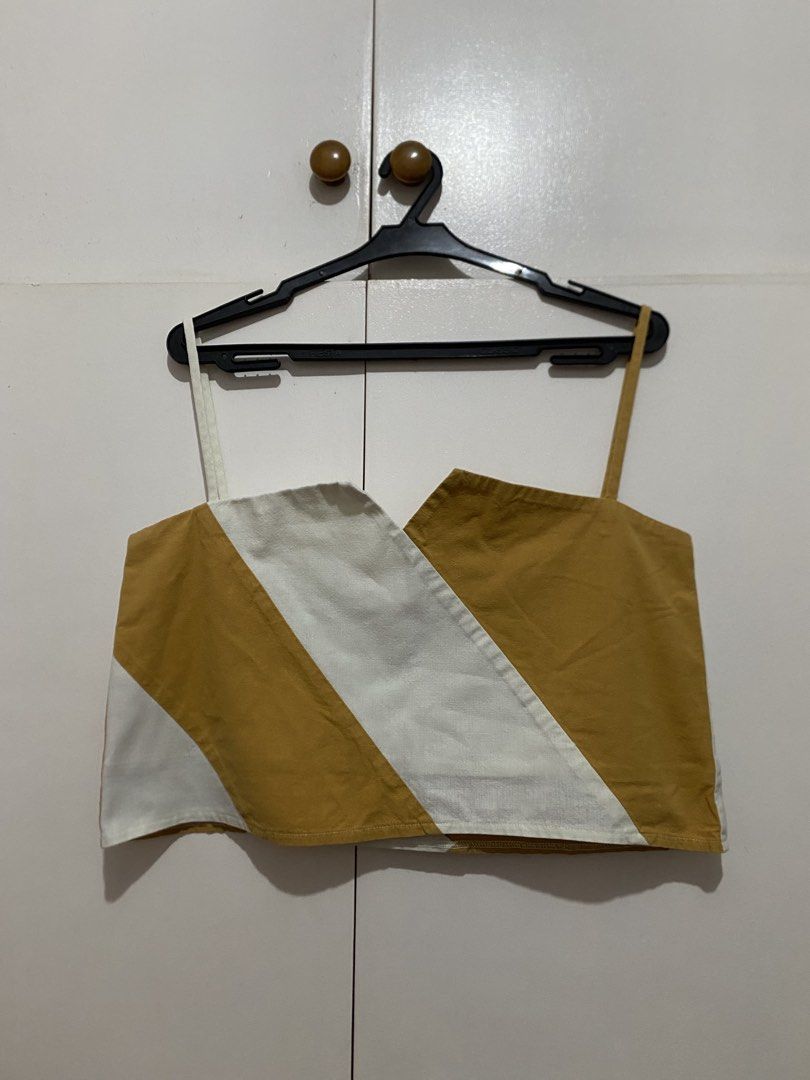 Brown and White Striped Asymmetrical Crop Top (Category: Others Tops) located in Quezon City. Submitted by addy_addy (Listing ID 1462815816, Image 3). Description: - Cute asymmetrical crop top - Bold brown and white stripe pattern - Breathable, light linen-blend fabric - Ideal for casual outings or beach trips - Versatile: pairs easily with shorts or skirts - Approximate measurements: •Bust (A-cut): 44 cm (upper hem); 48 cm (lower hem) • Length: 