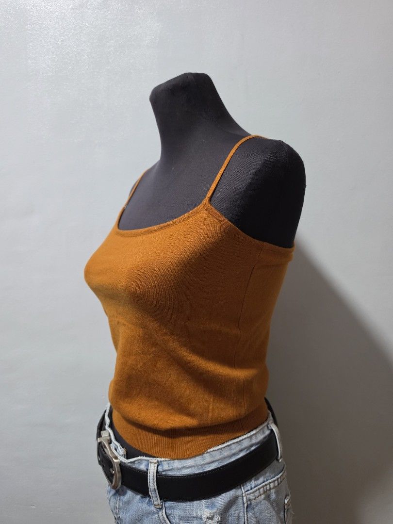 brown Knit Tank Top Spaghetti Straps small (Category: Sleeveless) located in Paranaque City. Submitted by franinnashop (Listing ID 1462688335, Image 2). Description: - Vibrant brown knit tank top - Features delicate spaghetti straps - Ribbed knit texture for a stylish look - Versatile for layering or standalone wear - Easily pairs with jeans, skirts, and other bottoms - A wardrobe essential for effortless styling declittr small paranaque ciry.
