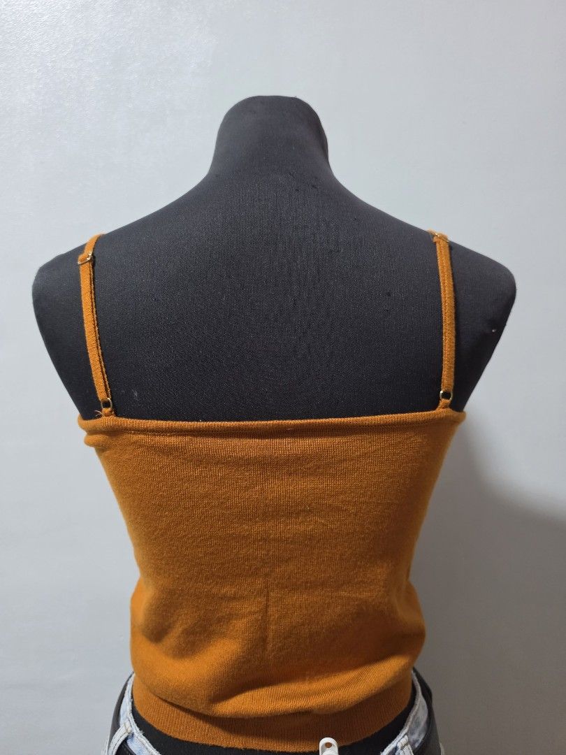 brown Knit Tank Top Spaghetti Straps small (Category: Sleeveless) located in Paranaque City. Submitted by franinnashop (Listing ID 1462688335, Image 3). Description: - Vibrant brown knit tank top - Features delicate spaghetti straps - Ribbed knit texture for a stylish look - Versatile for layering or standalone wear - Easily pairs with jeans, skirts, and other bottoms - A wardrobe essential for effortless styling declittr small paranaque ciry.