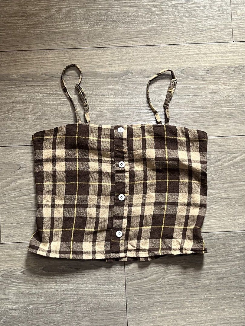 Brown Plaid Smocked Crop Top (Category: Others Tops) located in Mandaluyong City. Submitted by namislounge (Listing ID 1462722489, Image 1). Description: Selling to declutter! Best fits size small - Adorable brown plaid crop top - Smocked back for a comfortable and flexible fit - button front detail - Adjustable straps for a customizable fit - Versatile for casual wear or dressing up - Pairs perfectly with jeans or shorts.