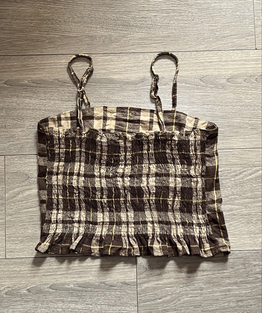 Brown Plaid Smocked Crop Top (Category: Others Tops) located in Mandaluyong City. Submitted by namislounge (Listing ID 1462722489, Image 2). Description: Selling to declutter! Best fits size small - Adorable brown plaid crop top - Smocked back for a comfortable and flexible fit - button front detail - Adjustable straps for a customizable fit - Versatile for casual wear or dressing up - Pairs perfectly with jeans or shorts.