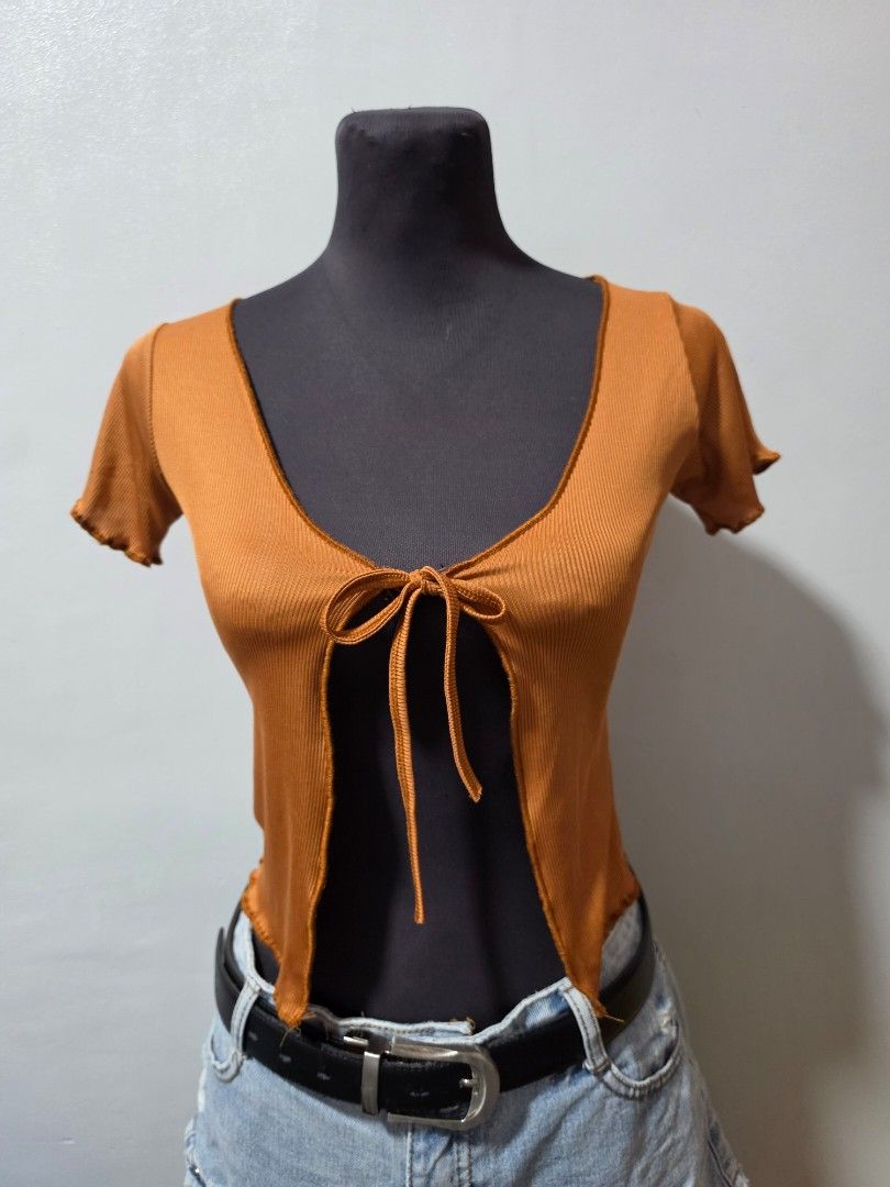 Brown Ribbed Tie-Back Crop Top small (Category: Others Tops) located in Paranaque City. Submitted by franinnashop (Listing ID 1462686971, Image 1). Description: - Cute brown ribbed crop top - Features a tie-back detail - Short sleeves with lettuce hem - Versatile for casual outings or nights with friends declutter small paranaque city.