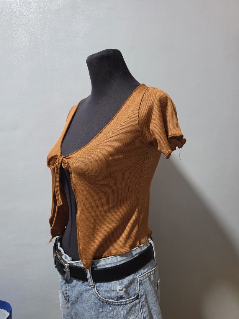 Brown Ribbed Tie-Back Crop Top small (Category: Others Tops) located in Paranaque City. Submitted by franinnashop (Listing ID 1462686971, Image 2). Description: - Cute brown ribbed crop top - Features a tie-back detail - Short sleeves with lettuce hem - Versatile for casual outings or nights with friends declutter small paranaque city.